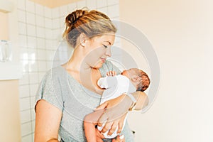 Happy young mother with newborn baby