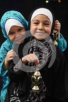 Happy Young Muslim Girls with Ramadan Lantern