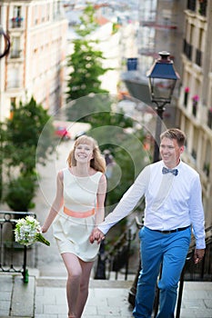 Happy young newly-wed couple on Montmartre photo