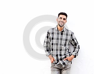 Happy young north african man smiling against white background