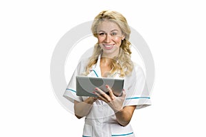 Happy young nurse with computer tablet.