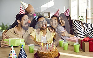 Happy young people congratulate friend with birthday