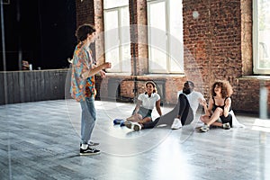 Happy young people during dance classes in studio