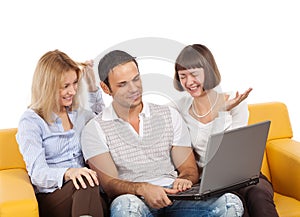 Happy young people with laptop computer