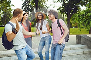 Happy young people smiling dance at a gathering in a city park