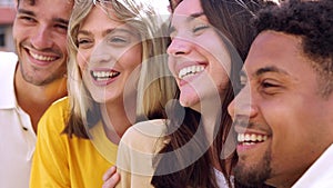 Happy young people smiling and laughing outdoors