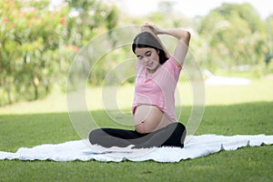 Happy young pregnant woman resting