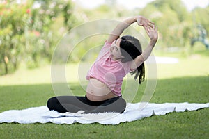 Happy young pregnant woman resting