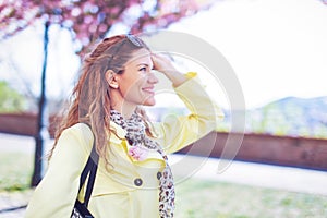 Happy young redhead woman toothy smile in park at springtime