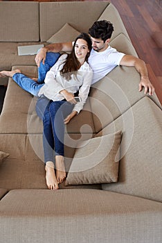 Happy young romantic couple have fun arelax relax at home