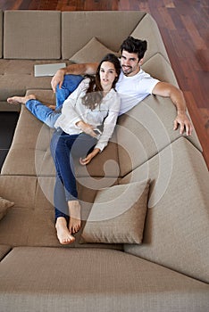 Happy young romantic couple have fun and relax at home indoors