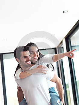Happy young romantic couple have fun and relax at home indoors