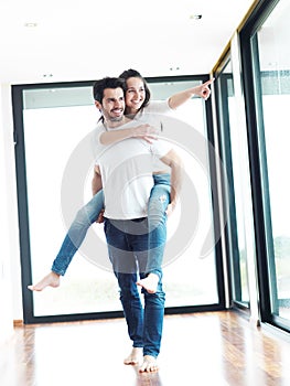 Happy young romantic couple have fun and relax at home indoors