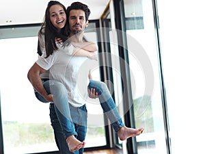 Happy young romantic couple have fun and relax at home indoors