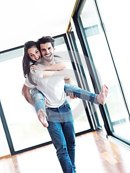 Happy young romantic couple have fun and relax at home indoors