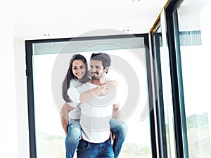 Happy young romantic couple have fun and relax at home indoors