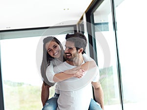 Happy young romantic couple have fun and relax at home indoors