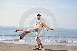 Happy young romantic couple in love have fun on beautiful beach at beautiful summer day.