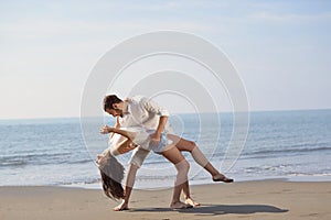 Happy young romantic couple in love have fun on beautiful beach at beautiful summer day.