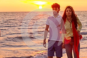 Happy young romantic couple in love have fun on beautiful beach at beautiful summer day