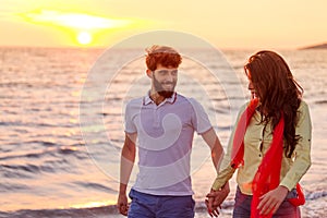 Happy young romantic couple in love have fun on beautiful beach at beautiful summer day