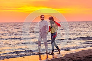 Happy young romantic couple in love have fun on beautiful beach at beautiful summer day