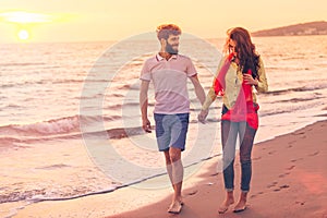 Happy young romantic couple in love have fun on beautiful beach at beautiful summer day