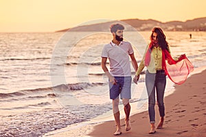 Happy young romantic couple in love have fun on beautiful beach at beautiful summer day