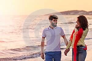 Happy young romantic couple in love have fun on beautiful beach at beautiful summer day