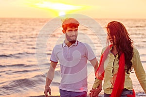Happy young romantic couple in love have fun on beautiful beach at beautiful summer day