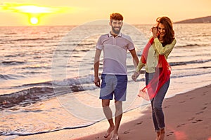 Happy young romantic couple in love have fun on beautiful beach at beautiful summer day