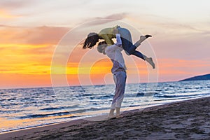 Happy young romantic couple in love have fun on beautiful beach at beautiful summer day