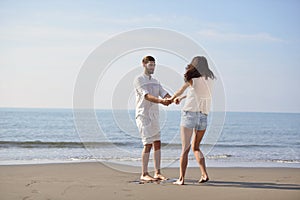 Happy young romantic couple in love have fun on beautiful beach at beautiful summer day.