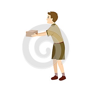 Happy young scout boy holding box for gift or present delivering mail package