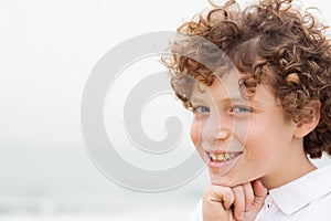 Happy young smiling boy at outdoor