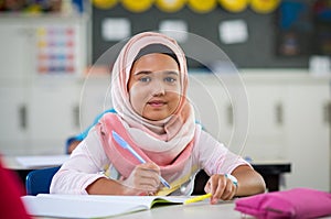 Young girl in hijab at school photo