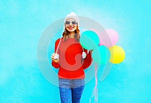 Happy young smiling woman with an air balloons