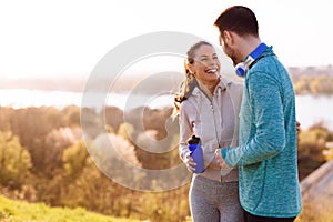 Happy young sporty couple sharing romantic moments