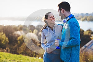 Happy young sporty couple sharing romantic moments