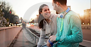 Happy young sporty couple sharing romantic moments