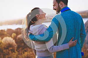 Happy young sporty couple sharing romantic moments