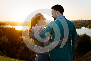 Happy young sporty couple sharing romantic moments