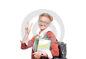 Happy young student girl holding books. Back to school