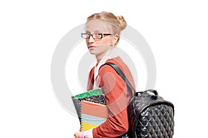 Happy young student girl holding books. Back to school