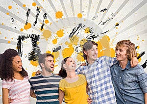 Happy young students standing against grey, yellow and black splattered background