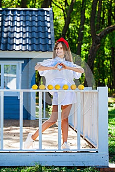 Happy young teenage girl with lemons