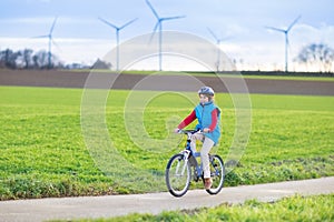 Happy young teenager boy riding his bike