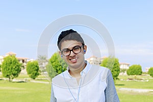 Happy Young teenager with earphones.