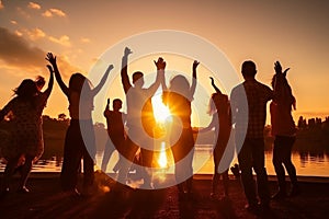 happy young teens dancing at the beach on beautiful summer sunset