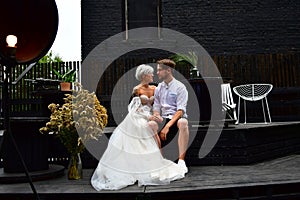 Happy young wedding couple kissing and hugging